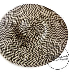 This black and straw polybraid cartwheel hat base is a classic shape that has sprung into popularity in the past year. Made from polybraid that has been spiralled and blocked, it has a petershams ribbon sewn into the inside crown for stability. Simply trim and add a comb or headband for securing to the head and your done!Measures:Width: 35cm (13.7 inches)Crown height: 2.5cm (1 inch)For even more millinery supplies you can find us here:www.etsy.com/shop/PetershamsAll orders are posted daily from Adjustable Black Woven Hat, Handmade Black Mini Hat For Beach, Black Woven Adjustable Hat, Black Adjustable Woven Hat, Black Woven Sun Hat With Flat Brim, Black Woven Flat Brim Sun Hat, Adjustable Black Woven Straw Hat, Beach Mini Hats In Black One Size, Black Mini Beach Hats, One Size