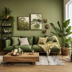 a living room with green walls and plants on the wall, including potted plants