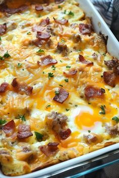 a casserole dish with eggs, ham and cheese