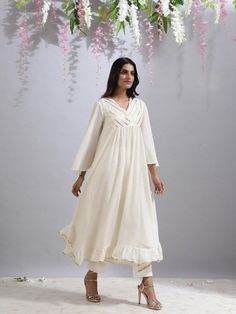 Jameela ivory tunic - Trendroots Cream Cotton Anarkali Kurta, Cream Anarkali Cotton Kurta, Anarkali Cotton Kurta In Cream, Traditional Cotton Kurta With Back Tassel Tie-up, Elegant Off White Cotton Kurta, Elegant Festive Cotton Tunic, Cotton Anarkali Dress With Lace Work, Off White Cotton Straight Kurta Dress, Off White Cotton Anarkali Dress