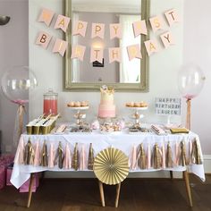 a birthday party with pink and gold decorations