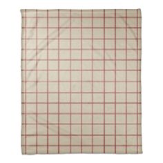 a beige and red plaid blanket on a white background