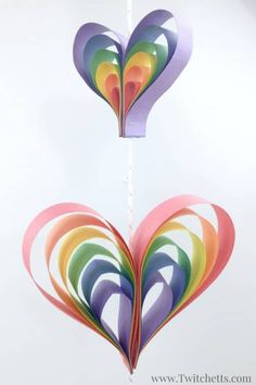 two paper hearts hanging from a string