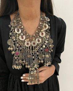 * This traditional oversized, Afghani necklace is heavily embellished with elements and material, including, stones, coins, and tassels. The long layers falling on the neck are flaunting all the traditional Afghani vibes. This craft is a staple of Afghani Kuchi Tribe, which has hundreds of years of history. You can pick it for any traditional attire or trendy outfit, as it would add the perfect amount of ethnic touch to the look. Note: The product is handmade, so slight change might occur in the Boho Cuff Bracelet, Hand Cuff Bracelet, Kuchi Jewelry, Boho Cuff, Fish Motif, Afghan Jewelry, Afghan Fashion, Hanging Beads, Headpiece Jewelry