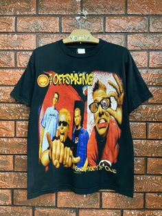 Vintage 00s The Offspring American Punk Rock Band T Shirt / American Punk / Vintage Alternative Band T Shirt Size M Condition : Good Used  Size on tag : M Colour : Black Brand : Unknown Measurement : Armpit to armpit - 20" Length - 25.5" Material : Cotton Made In: Unknown THE SHIPPING (Your Choice Please read) 1. The shipping cost is USD 20 via Malaysian Registered Postage With Tracking Number. It will take 2-4 weeks or more for delivery, depends on your custom checking. 2. Add USD 10 for speedy The Offspring, Punk Rock Bands, Punk Vintage, Band T Shirts, Pop Bands, American Shirts, Rock Band, Fancy Dresses, Punk Rock