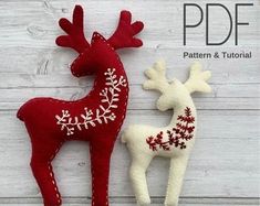 two red and white reindeer ornaments sitting next to each other