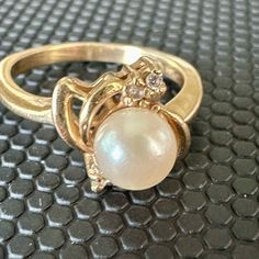 14k Yellow Gold Ring And Single Pearl Sculpted Design Flanked By 6 Diamonds. Weight: 3.9 Grams, Pearl: 6.5mm, Size: 7 , .12ct Tdw Pearl Rings In Gold, Classic Yellow Gold Pearl Ring With Charm, Elegant Gold-plated Pearl Ring For Formal Occasions, Yellow Gold Pearl Ring With Pearl Charm, Luxury 14k Gold Pearl Ring With Polished Finish, Luxury Yellow Gold Pearl Ring With Polished Finish, Gold Pearl Ring, Gold Pearl, Pearl Ring