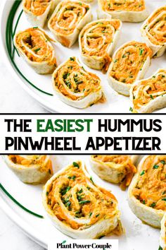 Overhead view of 14 tortilla pin wheels on a round white plate topped with green onions with text reading the easiest hummus pinwheel appetizer