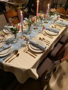 a table set with plates and place settings