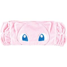 a pink headband with blue eyes on it