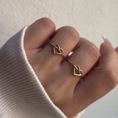 A timeless classic with a twist, this stunningly unique 14K Gold Heart Love Knot Ring is the perfect way to win the heart of a loved one or to enjoy yourself. Shined to a perfect luster and delicate enough to wear everyday, you will never want to take this beauty off! 

Size: 7mm (H) x 1.1mm Wire Band
Solid 14K Gold
Lifetime Guarantee
Made in Los Angeles Solid Gold Rings Unique, Love Knot Ring, Gold Heart Ring, Precious Rings, Tiny Rings, Enjoy Yourself, Knot Ring, Gold Piece, Love Knot