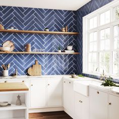 a kitchen with blue and white tiles on the wall, wooden counter tops and shelves