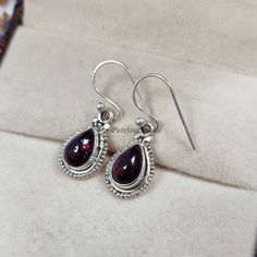 Red Garnet Hook Earring, 925 Sterling Silver Earring, Boho Designer Earring, Elegant Gemstone Earring, Handmade Jewelry, Gift For Christmas About These Earrings: Gemstone: Natural Red Garnet Stone Color: Red Metal: 925 Sterling Silver Polish: Silver Earring Weight: 2.80 Gram Approx. Theme: Love & Friendship Style: Boho & Hippie Handmade in the India You can also have a look on our other amazing similar products here- >Carnelian Earring-   shorturl.at/gkyCL >Labradorite Earring-   shorturl.at/fmpV2 > Ruby Earring-   shorturl.at/lqALU This kind of earrings also can be done in other shapes and finish as well. For the wholesale Inquiry please contact us. Visit Our Etsy Shop: https://www.etsy.com/in-en/shop/PureSoulJewels Carnelian Earrings, Silver Polish, Earrings Gemstone, Earring Handmade, Labradorite Earrings, Ruby Earrings, Handmade Jewelry Gift, Garnet Stone, Polish Silver