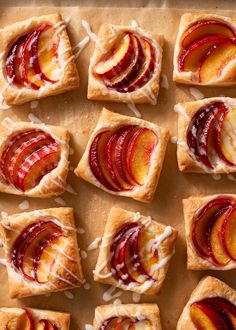 several pieces of fruit tarts with icing on top