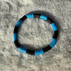 Handcrafted bracelet featuring intricate black and blue Heishi clay beads on a stretchy band. Size of bracelet in photo: 7 1/2 inches Bracelets Clay, Heishi Bead Bracelet, Clay Bead Bracelets, Dad Bracelet, Heishi Bracelets, Beaded Braclets, Clay Bead Bracelet, Blue Clay, Clay Bracelet