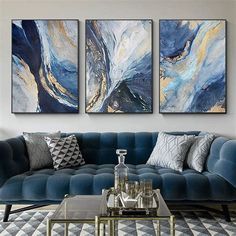 a living room with two paintings on the wall