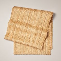 two pieces of woven material on a white surface with no background or image to describe