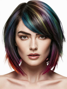 The shattered bob is a modern take on the classic bob, with choppy layers adding texture and movement. When paired with oil slick colors, it creates a striking contrast that enhances the edginess of the cut. This style is perfect for square and heart-shaped faces and complements dark brown or blue eyes. Blue Highlights In Brown Hair Short, Shattered Bob, Balayage Technique