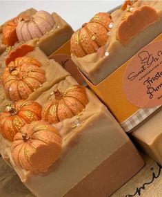 soap bars with pumpkins on them sitting on a table