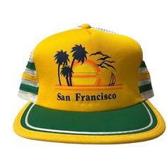 Vintage San Francisco Triangle Headwear One Size Flat Bill Snapback Trucker Hat This Vintage San Francisco Triangle Headwear One Size Flat Bill Snapback Trucker Hat Is A Must-Have For Any Fashion-Forward Man. The Yellow Color And Snap-Back Brand Make It A Unique Addition To Any Wardrobe. Made From A Blend Of Polyester And Cotton, This Hat Is Both Comfortable And Durable. It Features A One-Size-Fits-All Design, Making It A Great Gift For Any Man. The Hat Is Perfect For Any Occasion And Can Be Wor Vintage Summer Baseball Cap For Outdoor, Retro Outdoor Snapback Hat For Summer, Retro Snapback Hat For Summer Outdoor, Retro Summer Snapback Hat For Outdoor, Retro Summer Trucker Hat For Outdoor, Retro Summer Outdoor Snapback Hat, Vintage Summer Trucker Hat For Outdoor Activities, Retro Summer Snapback Hat With Curved Brim, Retro Snapback Hat For Outdoor Use In Spring