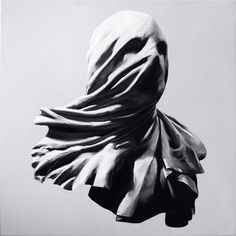 a black and white photo of a person's head covered in cloth