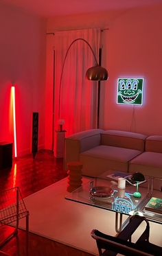 a living room filled with furniture and red lights