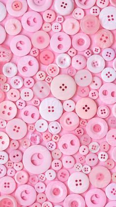 many pink buttons are arranged in rows