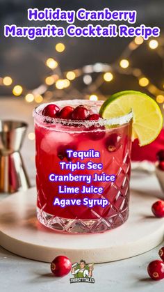 a holiday cranberry margarita cocktail recipe with text overlaying the image in purple