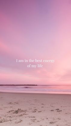 a beach with the words i am in the best energy of my life