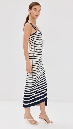 Find SIMKHAI Trudy Tank Midi Dress on Editorialist. The SIMKHAI Trudy Tank Midi Dress is crafted from a mid-weight ribbed knit with stretch. It features a stripe pattern, gathered waist, decorative button detail, round neckline, sleeveless design, and no closure. The dress is made of 86% rayon and 14% spandex. It is unlined and dry clean only. The dress measures 51.25 inches in length from the shoulder in a size S. Striped Ribbed Midi-length Dress, Fitted Striped Ribbed Midi Dress, Striped Ribbed Fitted Midi Dress, Fitted Striped Knit Dress, Striped Ribbed Fitted Dress, Ribbed Striped Fitted Dress, Basic Wardrobe Essentials, Jonathan Simkhai, Wardrobe Basics