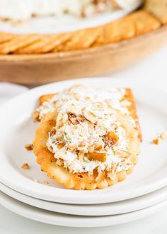 a plate with some food on top of it next to a basket of crackers