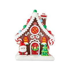 a gingerbread house is decorated with candy canes