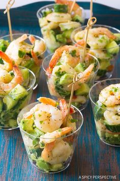 shrimp and broccoli salad in small cups with toothpicks on sticks for garnish