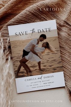 a save the date card on top of a blanket