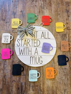 a sign that says it's all started with a mug surrounded by coffee cups