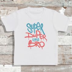 Hi All! Thank you for viewing my listing 'Super Duper Little Bro' baby and kids T-shirt, a lovely gift for a little one for any occasion. I have a combination of clothing products that I print on, mainly Personalised items to make your choice of clothing or gift unique! I use a combination of printing techniques on some designs from Vinyl and to printing directly onto the bodysuits. Please let me know if you have and specific designs or ideas that you may want and I'm sure I can do this for you Unisex White T-shirt As A Gift, Fun White T-shirt For Gifts, Fun White T-shirt As Gift, Playful White T-shirt With Funny Text, Funny White T-shirt With Name Print, Children In Need T Shirts, Playful Character Print T-shirt, Superhero Kid Shirt, Cool Kids T Shirts