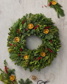 a christmas wreath and scissors on a table