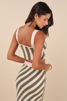 Set the stage for summer style with the Lulus Trending Muse Beige and Green Striped Knit Two-Piece Midi Dress! Soft and stretchy sweater knit, with a green striped design throughout, shapes this two-piece dress that starts with a tank straps, a square neckline, and a cropped, fitted bodice. Matching skirt features a high, elasticized waistband atop a figure-skimming column skirt with a kick pleat at back. Ribbed knit accents the neckline and waistband. Fit: This garment fits true to size. Length Fitted Knit Top For Day Out, Summer Stretch Knit Top, Stretch Summer Knit Top, Chic Fitted Knit Top For Beach, Chic Fitted Green Knit Top, Green V-neck Knit Top For Summer, Stretch Knit Top For Summer, Fitted Striped Knit Top For Spring, Fitted Striped Knit Top