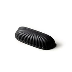 a black object sitting on top of a white surface