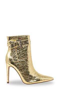 Gleaming grommets add street-savvy edge to this sleek pointed-toe bootie lofted by a sky-high stiletto heel. 4" heel 6" shaft; 9 1/2" calf circumference Synthetic upper, lining and sole Imported Trendy Pointed Toe Heeled Boots With Buckle Closure, Trendy Gold High Heeled Boots, Trendy Gold High Heel Boots, Gold Pointed Toe Heeled Boots For Spring, Spring Gold Pointed Toe Heeled Boots, Party High-top Boots With Buckle Closure, Chic Gold Snip Toe Boots, Gold High Heel Trendy Boots, Glamorous Studded Pointed Toe Boots