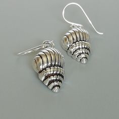 A PAIR of sterling silver conch shell ear danglers. Dimensions: 19 x 12 mm Drop length:32 mm Weight: 4.00 gm These earrings are made of 925 hypoallergenic sterling silver. All my pieces are sent in a gift box. I can include a personal message from you if needed. You are welcome to contact me at... bhavnakwintra1956@gmail.com More hoops: https://www.etsy.com/your/shops/TheSilverGame/tools/listings/section:26305414 More earrings: https://www.etsy.com/your/shops/TheSilverGame/tools/listings/section Silver Nickel-free Shell-shaped Earrings, Nickel-free Sterling Silver Shell-shaped Earrings, Nickel-free Shell-shaped Sterling Silver Earrings, Jewelry Beach, Conch Shell, 925 Silver Earrings, Shell Earrings, 925 Jewelry, Beach Jewelry