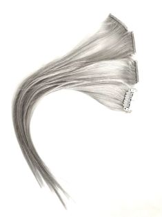 "Are you looking to change your hair instantly no dye or damage? Customised, bespoke, hair toppers are also available in the above colours on pre-order, please message me with your requirements. Introducing our exquisite Silver Grey Human Hair Extension Highlights 1\" wide Clip-in. Crafted from virgin Remy human hair, these clip-in highlights offer unparalleled quality and natural-looking results. The silver grey shade adds a touch of sophistication and modernity to your hair, making it the perfect choice for fashion-forward individuals like yourself. With our easy-to-use clip-in system, you can effortlessly transform your look in minutes. Simply snap the extensions into place and witness an instant boost of volume, length, and dimension. Whether you desire a subtle enhancement or a dramat Extension Highlights, Grey Hair Accessories, Highlights Silver, Grey Hair Extensions, Hair Extensions Clip, Grey Highlights, Extensions Clip In, Silver Hair Clip, Silver Grey Hair