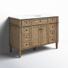 an image of a bathroom vanity with marble top and wooden cabinetry on white background