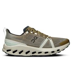 the on cloud running shoe in grey and white with black accents, front view from the side