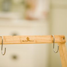 a wooden rack with hooks hanging from it