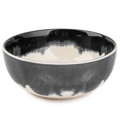 a black and white bowl sitting on top of a table