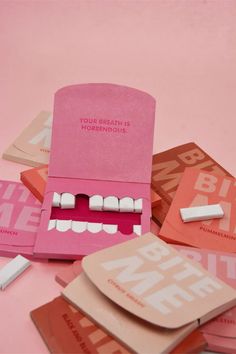 a pile of pink and white cards with teeth on them that say, your breath is my mouth