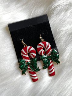 *Perfect holiday earrings, cuper cute candy canes *Gold metal with red, white and sparkling green enamel *Fish hook style *1.75"X0.75" Skeleton Earrings, Holiday Earrings, Cute Candy, Holiday Earring, Candy Canes, Green Enamel, Fish Hook, Heart Earrings, Candy Cane