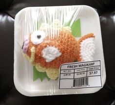 there is a plastic tray that has a crocheted fish on it, and the price tag is $ 1 99