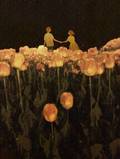 two people holding hands in the middle of a field of flowers with lights on them